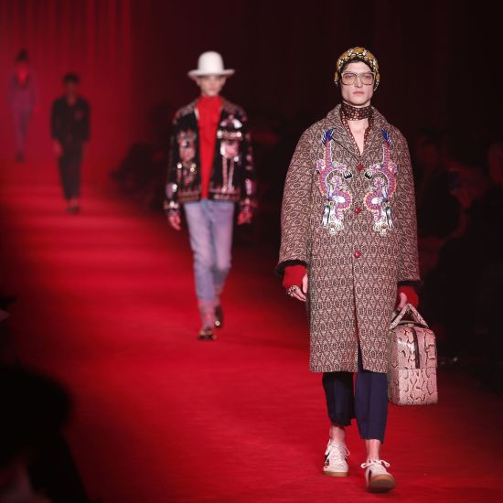 Models wear creations for Gucci men's Fall-Winter 2016-2017 collection, part of the Milan Fashion Week, unveiled in Milan, Italy, Monday, Jan. 18, 2016. (AP Photo/Antonio Calanni)