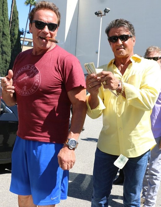 Sylvester-Stallone-making-it-rain-on-pal-Arnold-Schwarzenegger